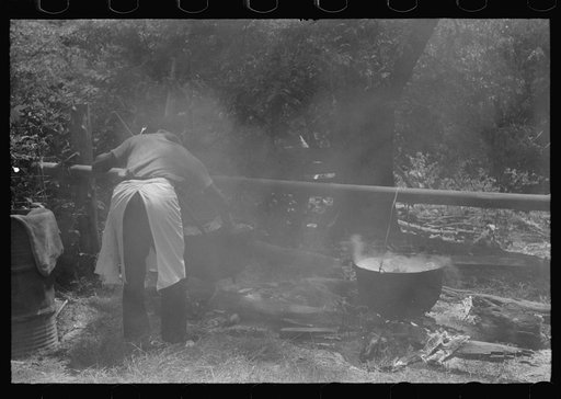 Untitled photo, possibly related to: Barbecuing beef and lamb for a benefit picnic supper on the grounds of St. Thomas' Church. Near Bardstown, Kentucky