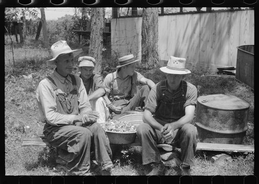 Untitled photo, possibly related to: Parishoners peeling potatoes for a benefit picnic supper on the grounds of St. Thomas' Church. Near Bardstown, Kentucky