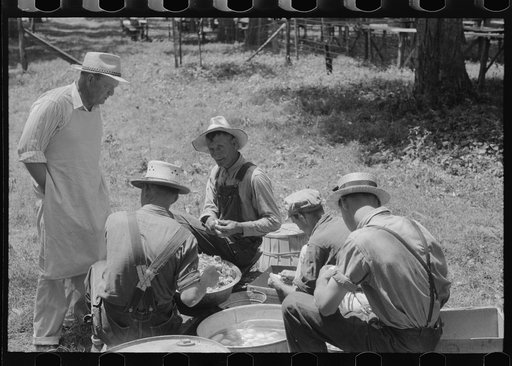 Untitled photo, possibly related to: Parishoners peeling potatoes for a benefit picnic supper on the grounds of St. Thomas' Church. Near Bardstown, Kentucky