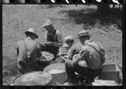 Parishoners peeling potatoes for a benefit picnic supper on the grounds of St. Thomas' Church. Near Bardstown, Kentucky