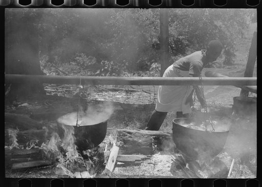 Barbecueing beef and lamb for a benefit picnic supper on the grounds of St. Thomas' Church. Near Bardstown, Kentucky