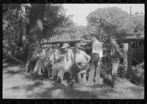 Untitled photo, possibly related to: Parishoners gossiping while waiting for picnic supper at St. Thomas Church Picnic near Bardstown, Kentucky