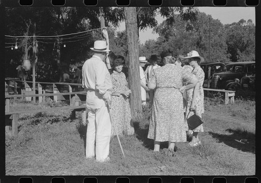 Untitled photo, possibly related to: Parishoners gossiping while waiting for picnic supper at St. Thomas Church Picnic near Bardstown, Kentucky