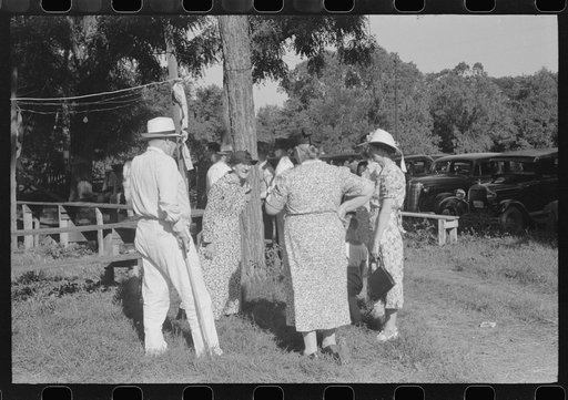 Parishoners gossiping while waiting for picnic supper at St. Thomas Church Picnic near Bardstown, Kentucky