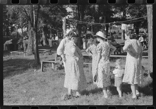 Untitled photo, possibly related to: Parishoners gossiping while waiting for picnic supper at St. Thomas Church Picnic near Bardstown, Kentucky