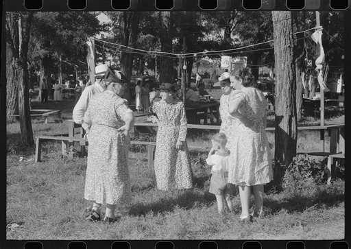 Untitled photo, possibly related to: Parishoners gossiping while waiting for picnic supper at St. Thomas Church Picnic near Bardstown, Kentucky