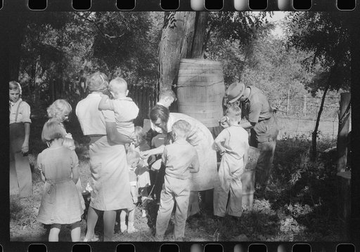 Untitled photo, possibly related to: Parishoners gossiping while waiting for picnic supper at St. Thomas Church Picnic near Bardstown, Kentucky
