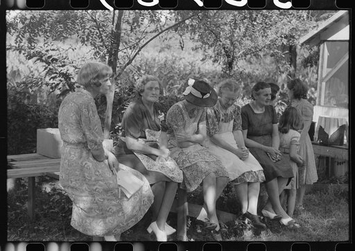 Parishoners of St. Thomas Church resting after spending many hous preparing food for a benefit picnic supper. Near Bardstown, Kentucky