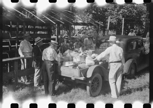 Untitled photo, possibly related to: Unpacking supplies at the St. Thomas Church picnic supper near Bardstown, Kentucky