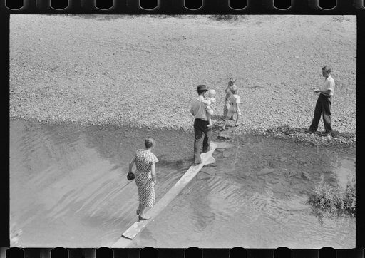 Mountain people leaving the Primitive Baptist Church in Morehead, Kentucky and going down to the creek for a baptizing