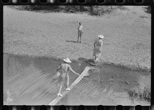 Mountain people leaving the Primitive Baptist Church in Morehead, Kentucky and going down to the creek for a baptizing