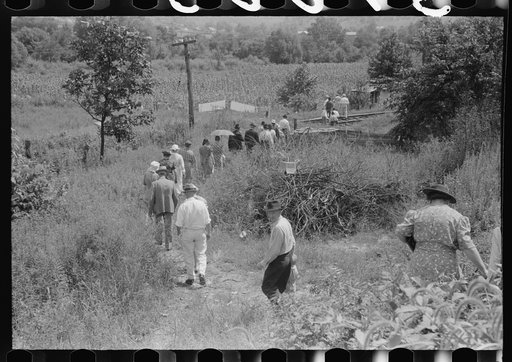 Mountain people leaving the Primitive Baptist Church in Morehead, Kentucky and going down to the creek for a baptizing