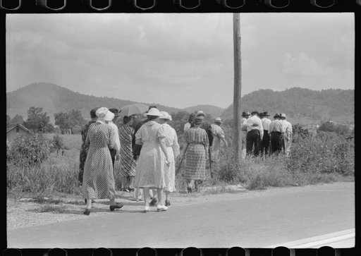 Mountain people leaving the Primitive Baptist Church in Morehead, Kentucky and going down to the creek for a baptizing