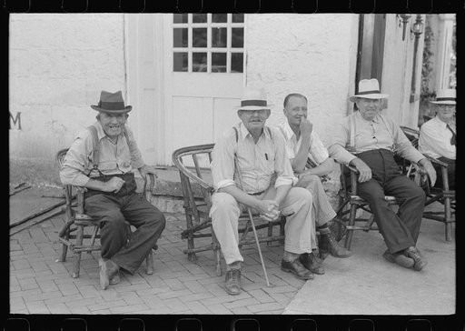Untitled photo, possibly related to: Townspeople visiting while sitting in front of Old Talbott Tavern on Saturday afternoon. Bardstown, Kentucky