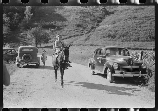 Relatives and friends of the family of the deceased going home from a memorial meeting in the mountains near Jackson, Kentucky. See general caption no. 1