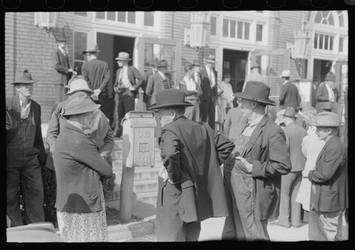 Mountain people exchanging greetings and news on court day in front of the federal building, Jackson, Breathitt County, Kentucky
