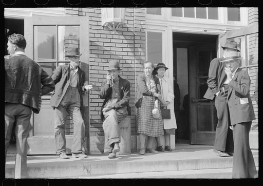 Mountain people exchanging greetings and news on court day in front of the federal building, Jackson, Breathitt County, Kentucky