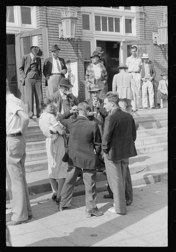 Mountain people exchanging greetings and news on court day in front of the federal building, Jackson, Breathitt County, Kentucky