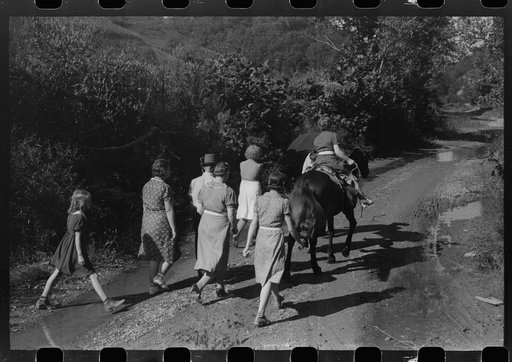Relatives and friends of the family of the deceased going home from a memorial meeting in the mountains near Jackson, Kentucky. See general caption no. 1