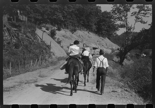 Relatives and friends of the family of the deceased going home from a memorial meeting in the mountains near Jackson, Kentucky. See general caption no. 1