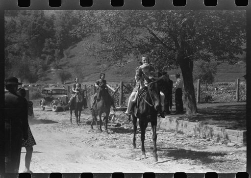 Relatives and friends of the family of the deceased going home from a memorial meeting in the mountains near Jackson, Kentucky. See general caption no. 1