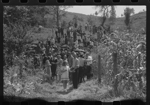 Relatives and friends of the family of the deceased going home from a memorial meeting in the mountains near Jackson, Kentucky. See general caption no. 1