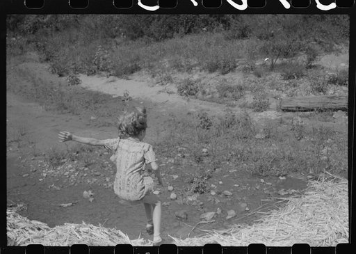 Untitled photo, possibly related to: Pouring off and straining finished sorghum syrup after it had been boiled down at a "syruping off" on the highway between Jackson and Campton, Kentucky