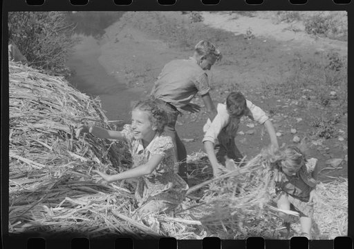 Untitled photo, possibly related to: Pouring off and straining finished sorghum syrup after it had been boiled down at a "syruping off" on the highway between Jackson and Campton, Kentucky