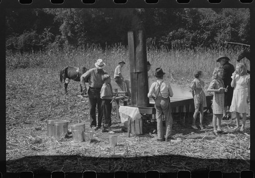 Untitled photo, possibly related to: Boiling down the sorghum cane sap into syrup. At a mountaineer's home on the highway between Jackson and Campton, Kentucky