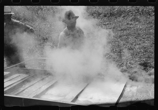 Untitled photo, possibly related to: Boiling down the sorghum cane sap into syrup. At a mountaineer's home on the highway between Jackson and Campton, Kentucky