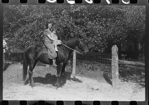 Mother and child start off to get supplies up Burton's Fork, Kentucky River, near Jackson, Kentucky