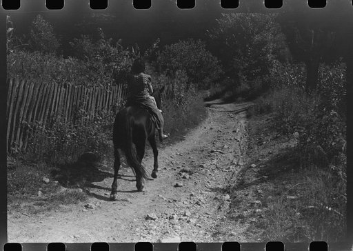 Untitled photo, possibly related to: Mother and child start off to get supplies up Burton's Fork, Kentucky River, near Jackson, Kentucky