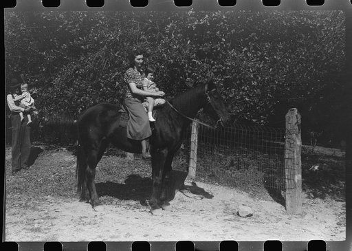 Untitled photo, possibly related to: Mother and child start off to get supplies up Burton's Fork, Kentucky River, near Jackson, Kentucky