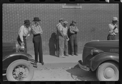 Untitled photo, possibly related to: Farmer listening to itinerant salesman on court day, Campton, Kentucky
