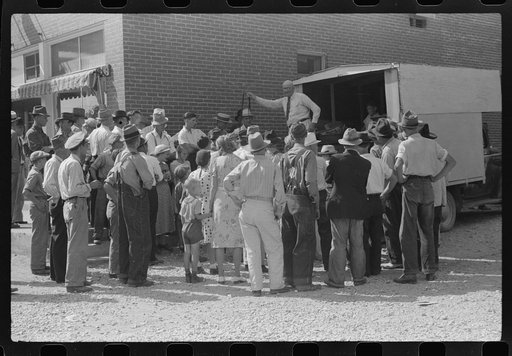 Untitled photo, possibly related to: Farmer listening to itinerant salesman on court day, Campton, Kentucky