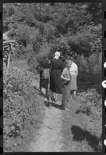 Untitled photo, possibly related to: Mountain people carrying a homemade coffin up creek bed to the family plot on the hillside where it will be buried. This section is too isolated to hold any formal funeral services immediately. Up South Fork of the Kentucky River near Jackson, Kentucky