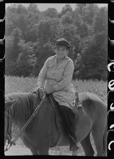 Mountain woman riding to town up Frozen Creek, near Jackson, Breathitt County, Kentucky