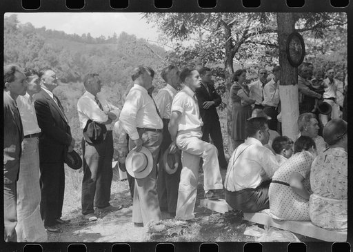 Untitled photo, possibly related to: Friends and relatives of the deceased listening to the preacher at an annual memorial meeting. Up Frozen Creek, near Jackson, Breathitt County, Kentucky. See general caption no. 1.