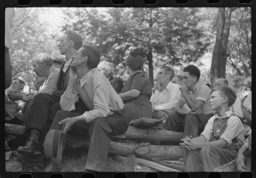 Friends of the deceased's family, at an annual memorial meeting in the family cemetery. In the mountains near Jackson, Kentucky