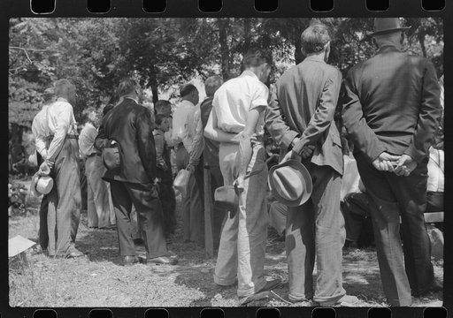 Untitled photo, possibly related to: Friends and relatives of the deceased listening to the preacher at an annual memorial meeting. Up Frozen Creek, near Jackson, Breathitt County, Kentucky. See general caption no. 1.