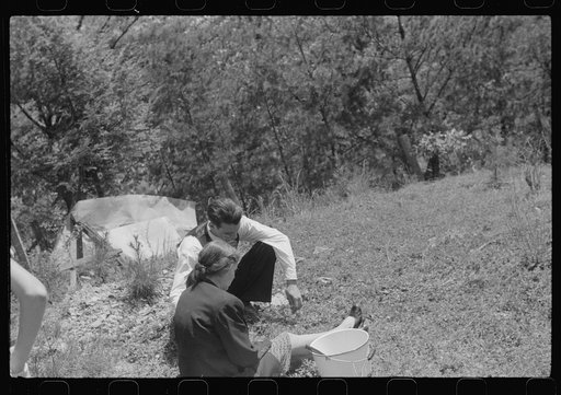 Untitled photo, possibly related to: Widow and brother of the deceased grieving at memorial meeting near Jackson, Breathitt County, Kentucky