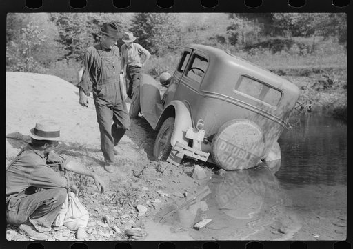 Mountaineers trying to get car out of creek. Up South fork of the Kentucky River, Breathitt County, Kentucky