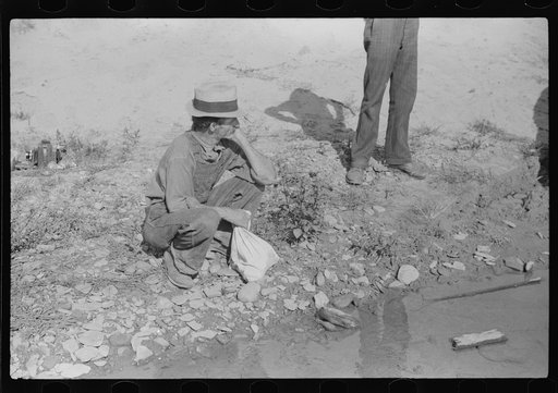 Untitled photo, possibly related to: Mountaineers trying to get car out of creek. Up South fork of the Kentucky River, Breathitt County, Kentucky