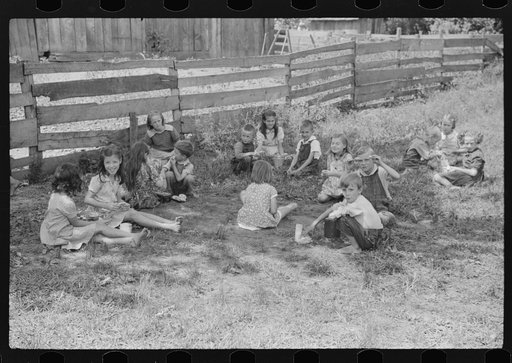 Untitled photo, possibly related to: Going home from school. In Breathitt County, Kentucky. The school year begins in July and ends in January as most of the children have no shoes and insufficient clothing to walk the long distances over bad roads and up creek beds