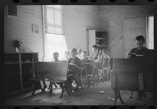 Untitled photo, possibly related to: Going home from school. In Breathitt County, Kentucky. The school year begins in July and ends in January as most of the children have no shoes and insufficient clothing to walk the long distances over bad roads and up creek beds