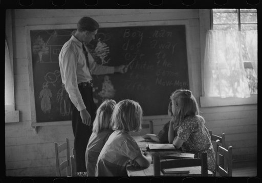 Untitled photo, possibly related to: Going home from school. In Breathitt County, Kentucky. The school year begins in July and ends in January as most of the children have no shoes and insufficient clothing to walk the long distances over bad roads and up creek beds