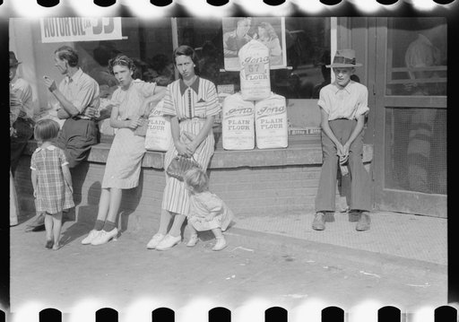 Untitled photo, possibly related to: Farmers and their families hanging around in front of stores on Saturday. Jackson, Kentucky