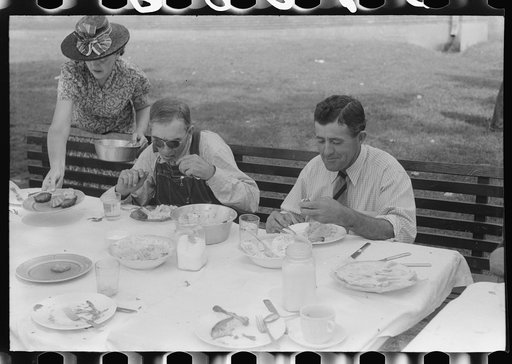 Eating dinner served for benefit of the church in courthouse yard on court day. Campton, Wolfe County, Kentucky