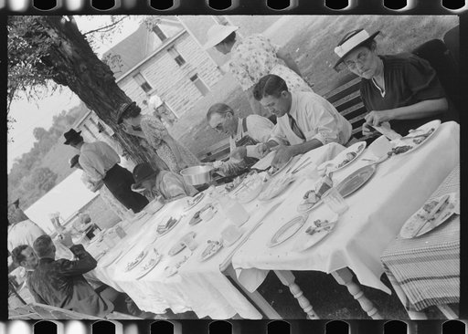 Untitled photo, possibly related to: Mountaineers and farmers eating dinner served for benefit of the church in courthouse yard on court day. Campton, Wolfe County, Kentucky