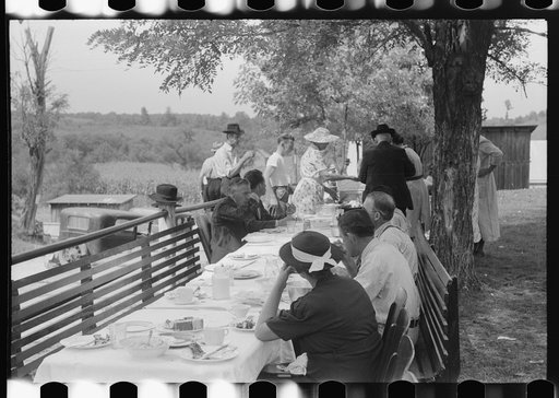 Untitled photo, possibly related to: Mountaineers and farmers eating dinner served for benefit of the church in courthouse yard on court day. Campton, Wolfe County, Kentucky